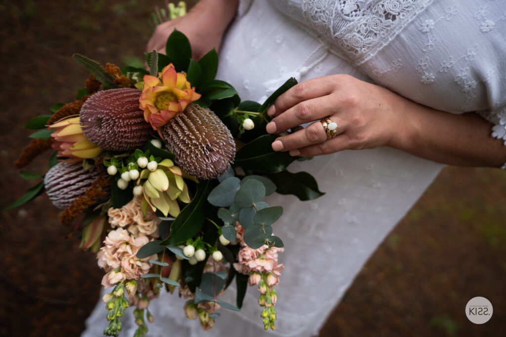 Native flower bouquet held by a bride