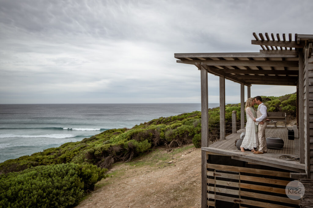 A wedding couple on an ocean-view deck on Kangaroo Island