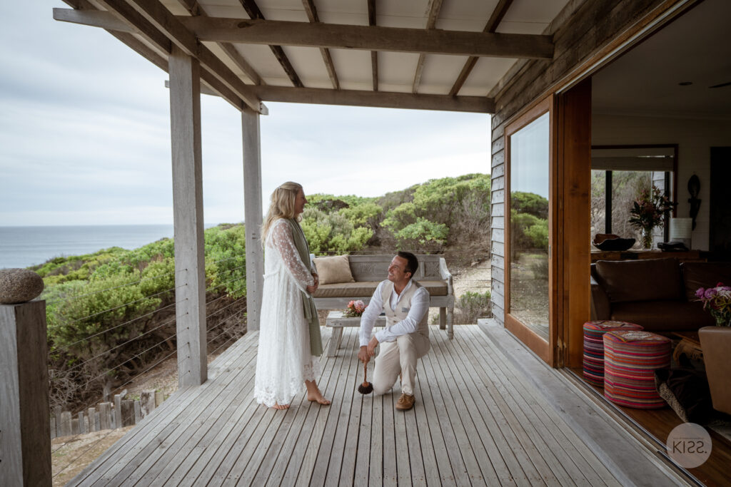 A couple relaxing on the deck at Wild Side Ocean Retreat