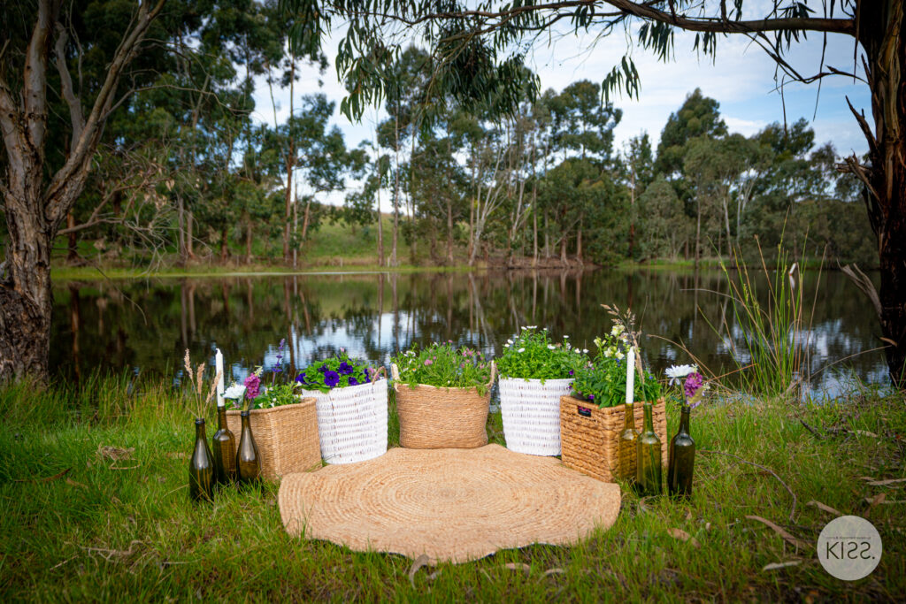 Outdoor lounge setting beside the pond in a vineyard setting