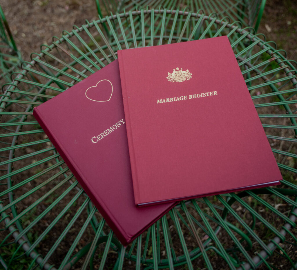 Marriage register and certificate books on a garden table