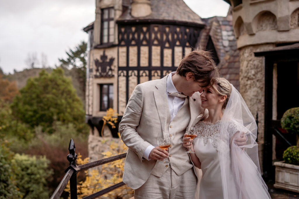 A wedding couple embracing beside Thorngrove Manor
