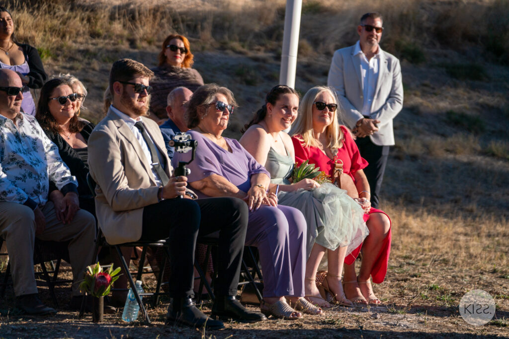 Seated guests watching a wedding ceremony