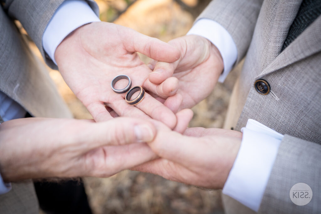 A pair of wedding rings resting in open hands