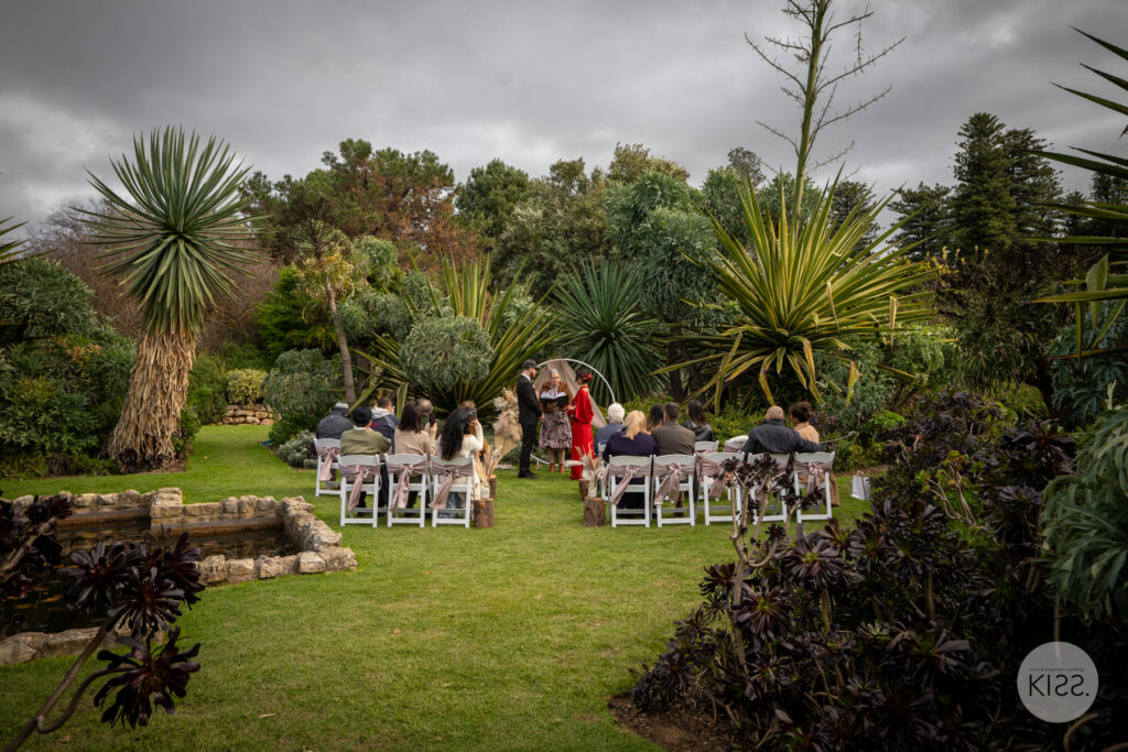 Guests gathered for a garden wedding ceremony