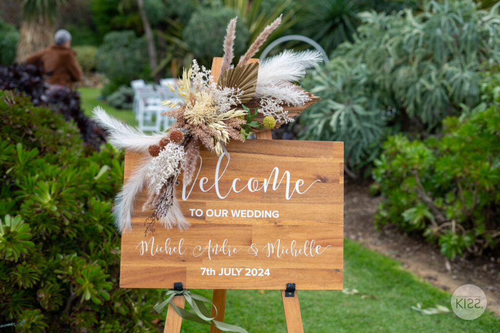 Personalised wooden wedding welcome sign decorated with flowers