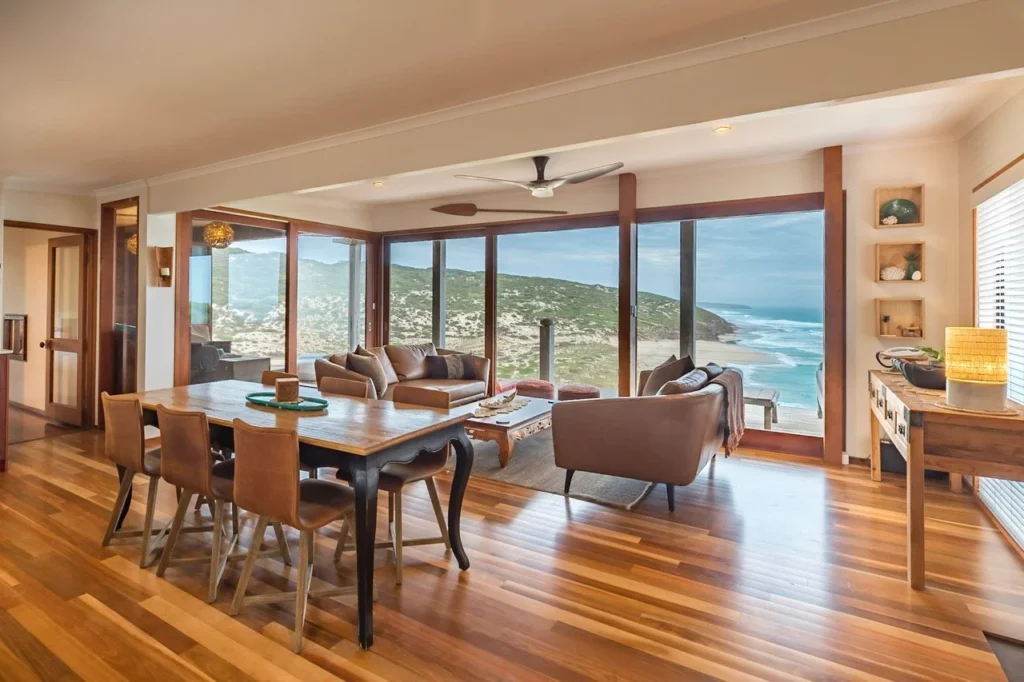 Dining and living area overlooking the coast at Wild Side Ocean Retreat