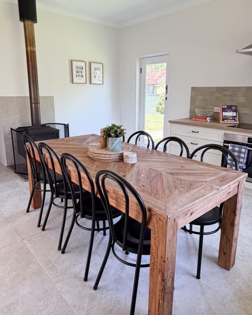 Dining table and chairs inside an Adelaide Hills cottage