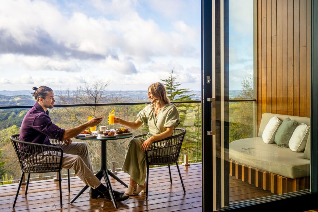 A couple dining on a balcony at Sequoia
