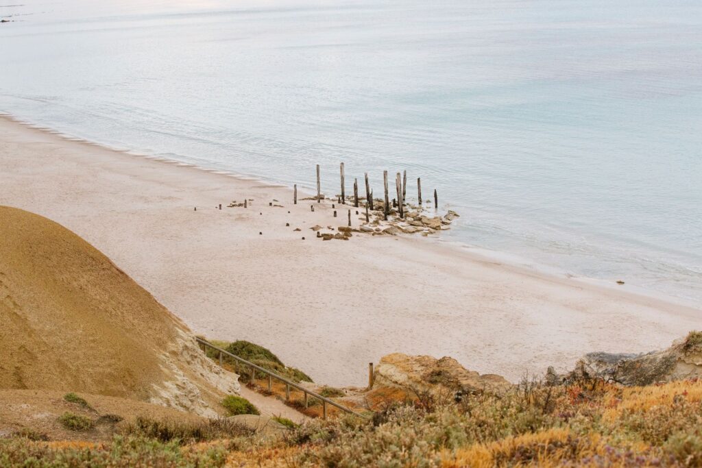 Port Willunga beach and the old jetty remains viewed from the cliffs
