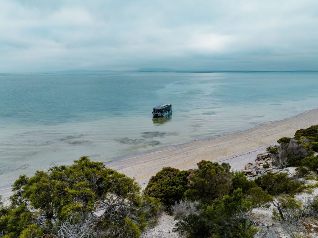 Boat moored in the clear coastal water at Coffin Bay