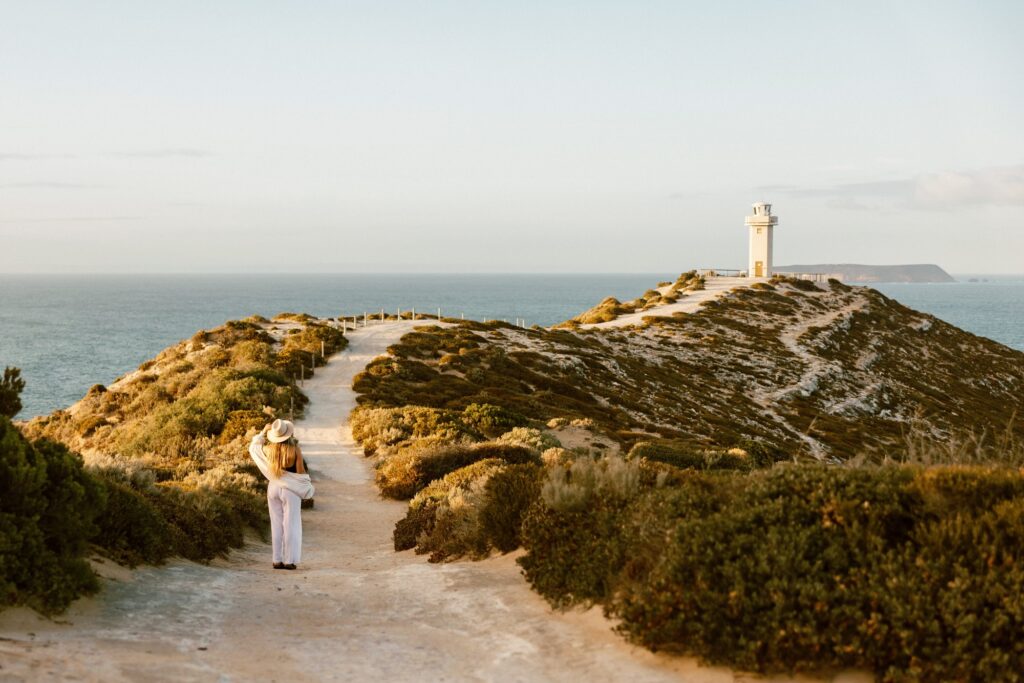 A visitor on the path towards Cape Spencer Lighthouse.