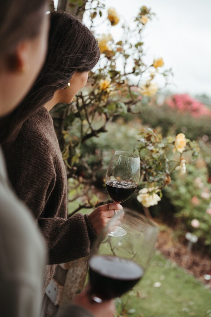 Visitors enjoying wine beside the rose garden at Balnaves of Coonawarra.
