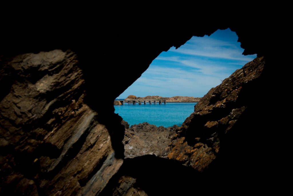View through coastal rocks toward the sea at Second Valley.