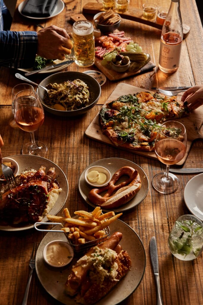 Shared meal and drinks at The Haus Hahndorf.