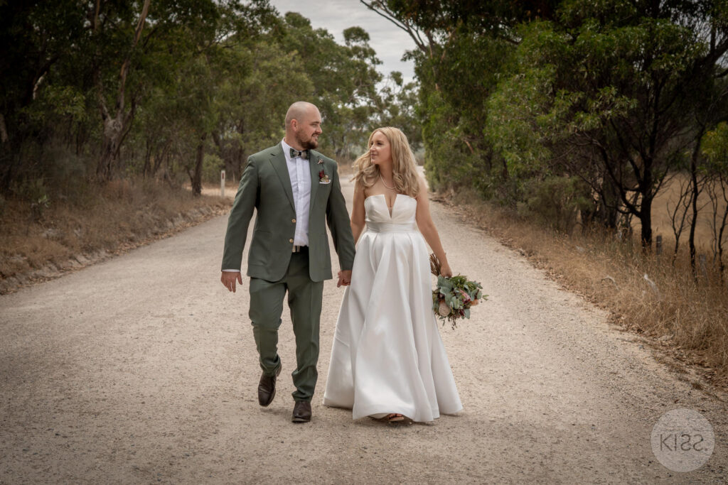 A couple walking along a country road near Rocky Creek Hut