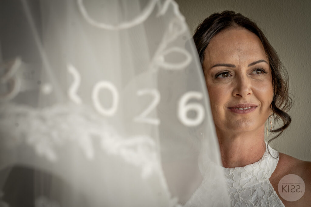 A bride seen through her veil at Adelaide Botanic Garden