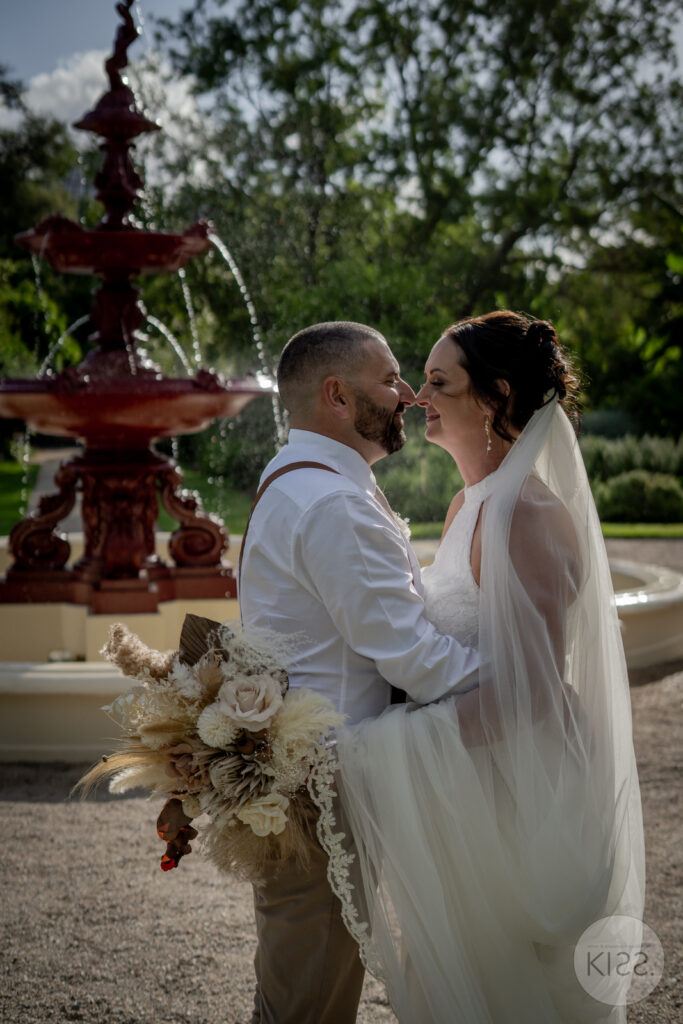 A couple beside a fountain at Adelaide Botanic Garden