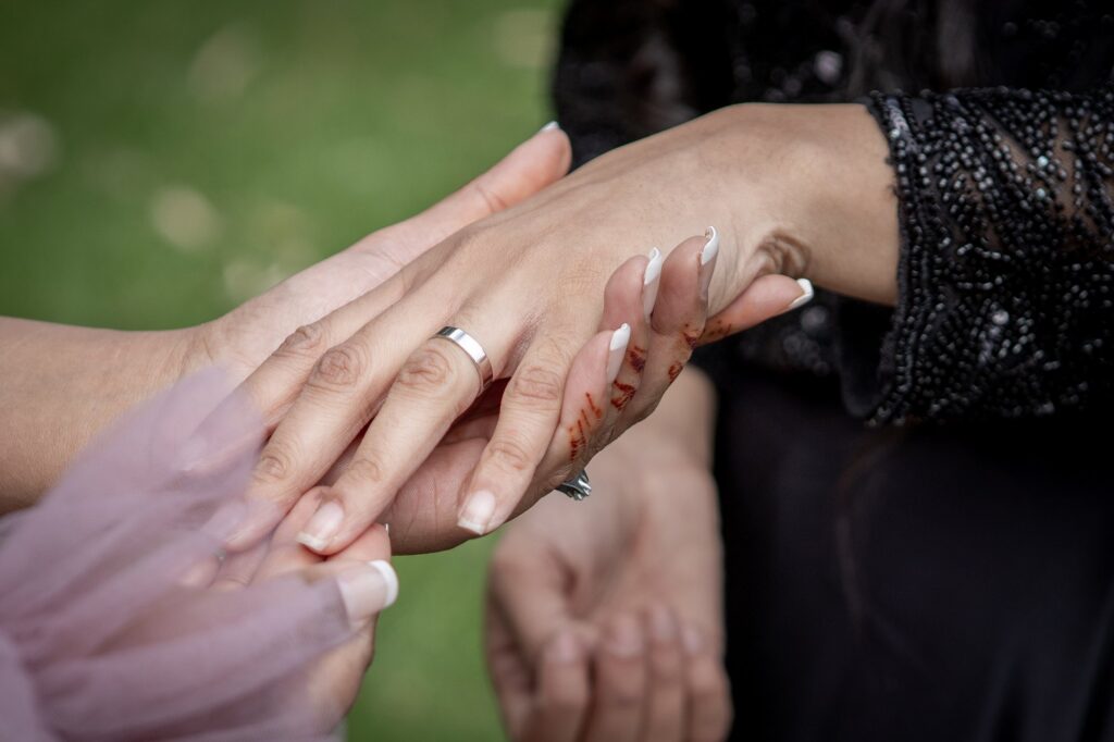 A close view of newly married hands resting together